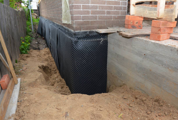Happy homeowners after waterproofing job in Claypool
